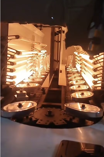 Blow molding machine heating assembly